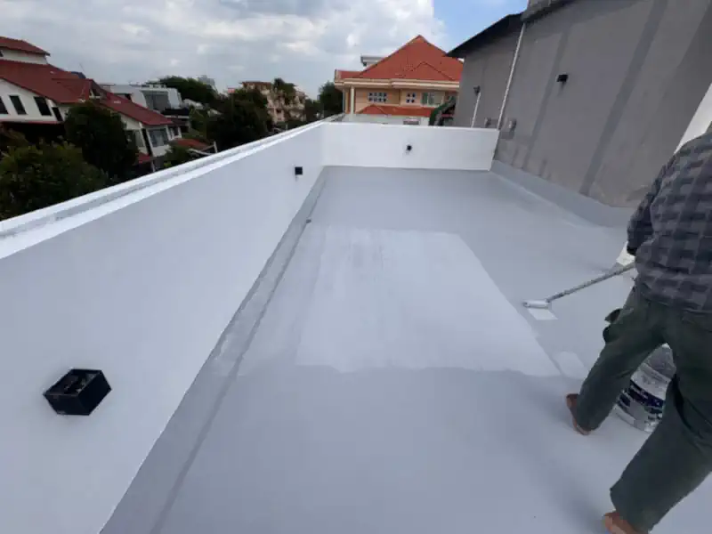 Professional contractor inspecting painting and waterproofing work in Singapore